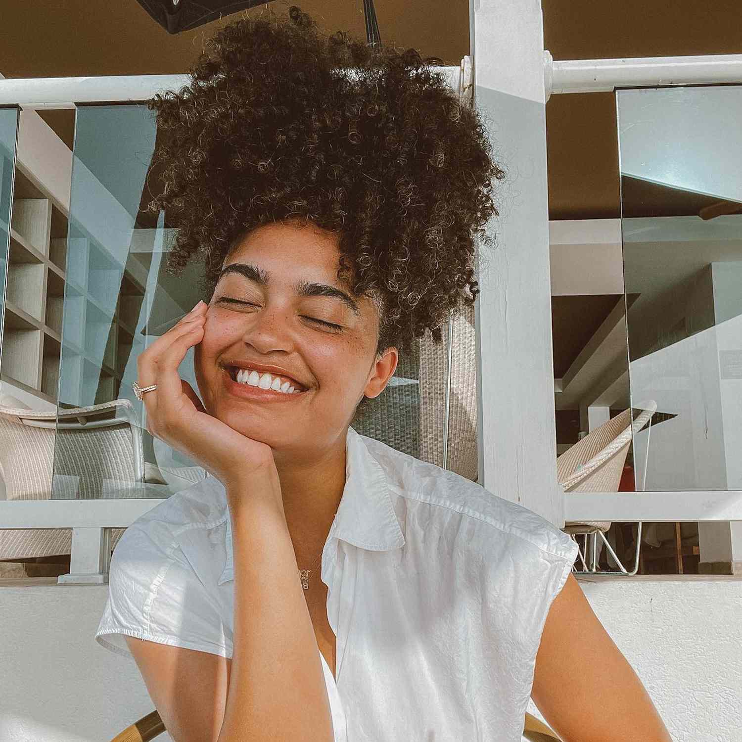 girl with natural hair styled in a pineapple