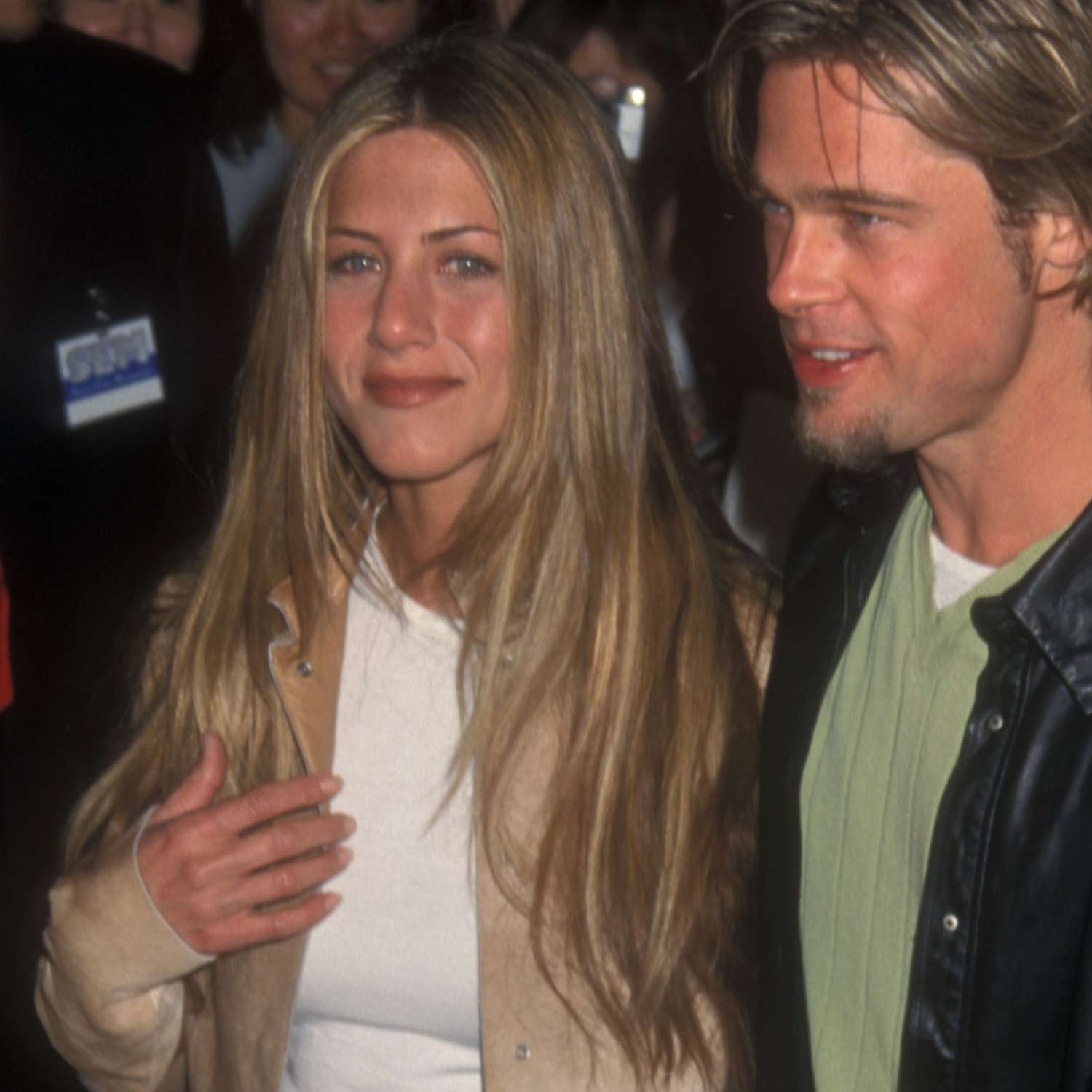 close up of jennifer aniston's hair, super long layers, middle part, dark blonde, next to brad pitt