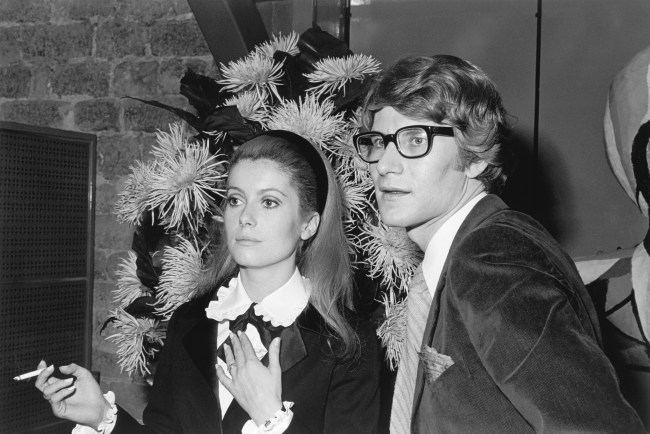 French actress Catherine Deneuve stands with fashion designer Yves Saint Laurent, for whom she sometimes models.