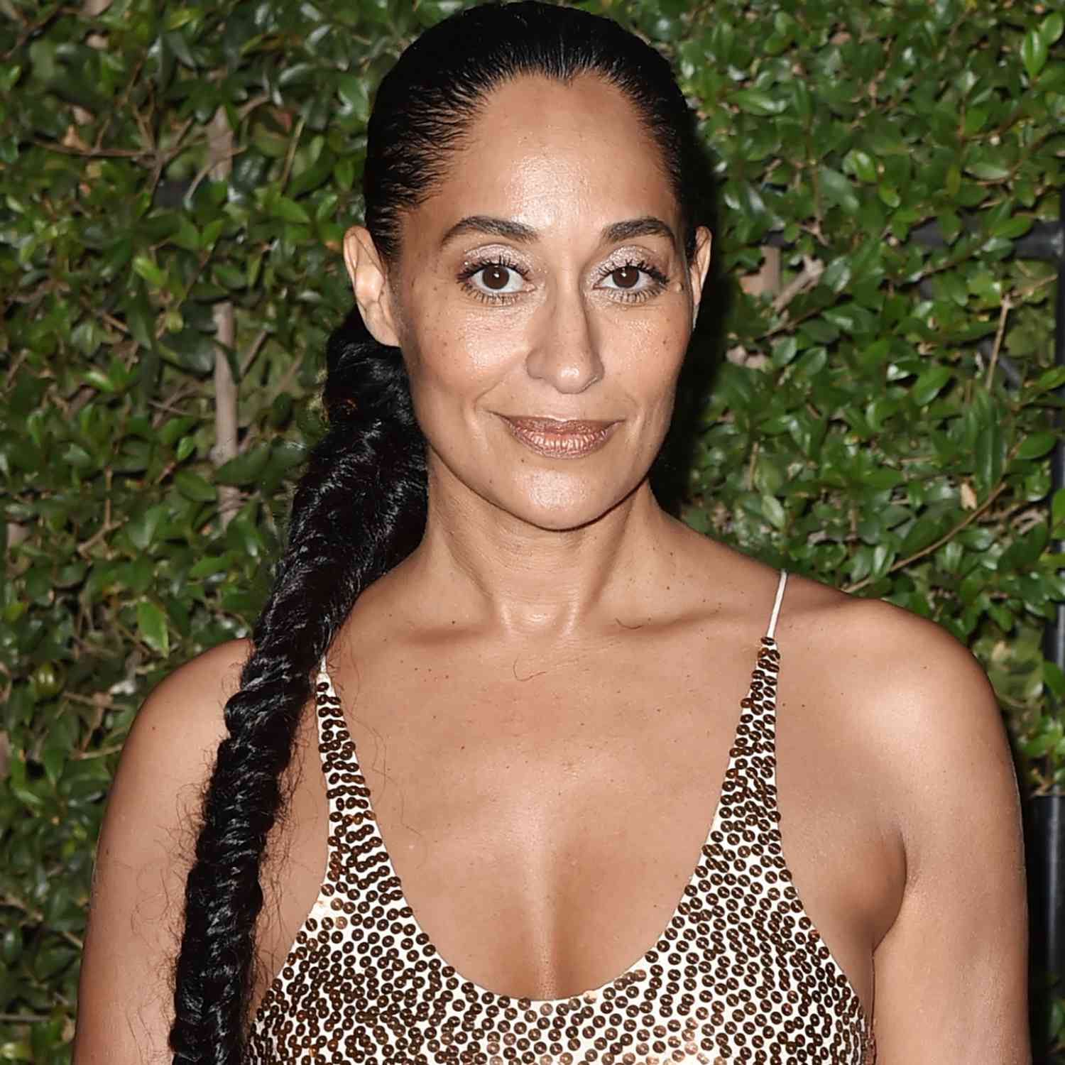 Tracee Ellis Ross wears a low fishtail braid and no visible parting