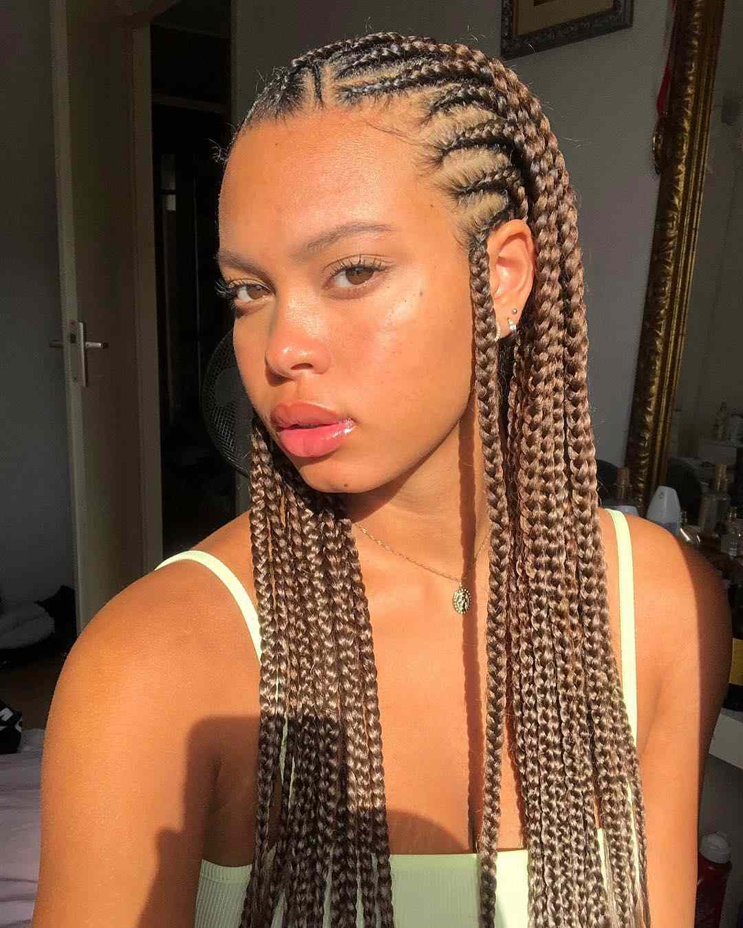 woman in golden light with Fulani Braids 