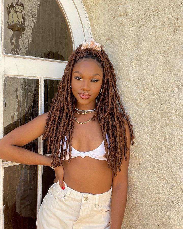 woman with red faux locs 